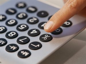 Finger Pressing Button on Calculator